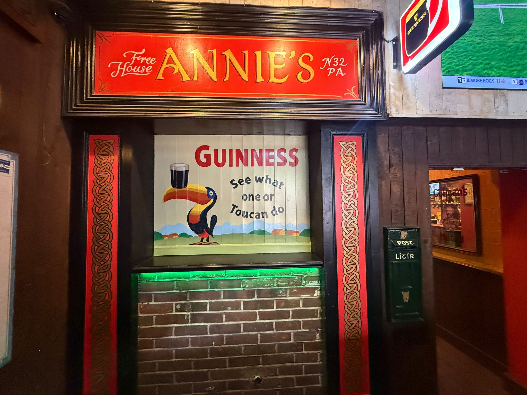 Vintage Guinness toucan sign above the snug