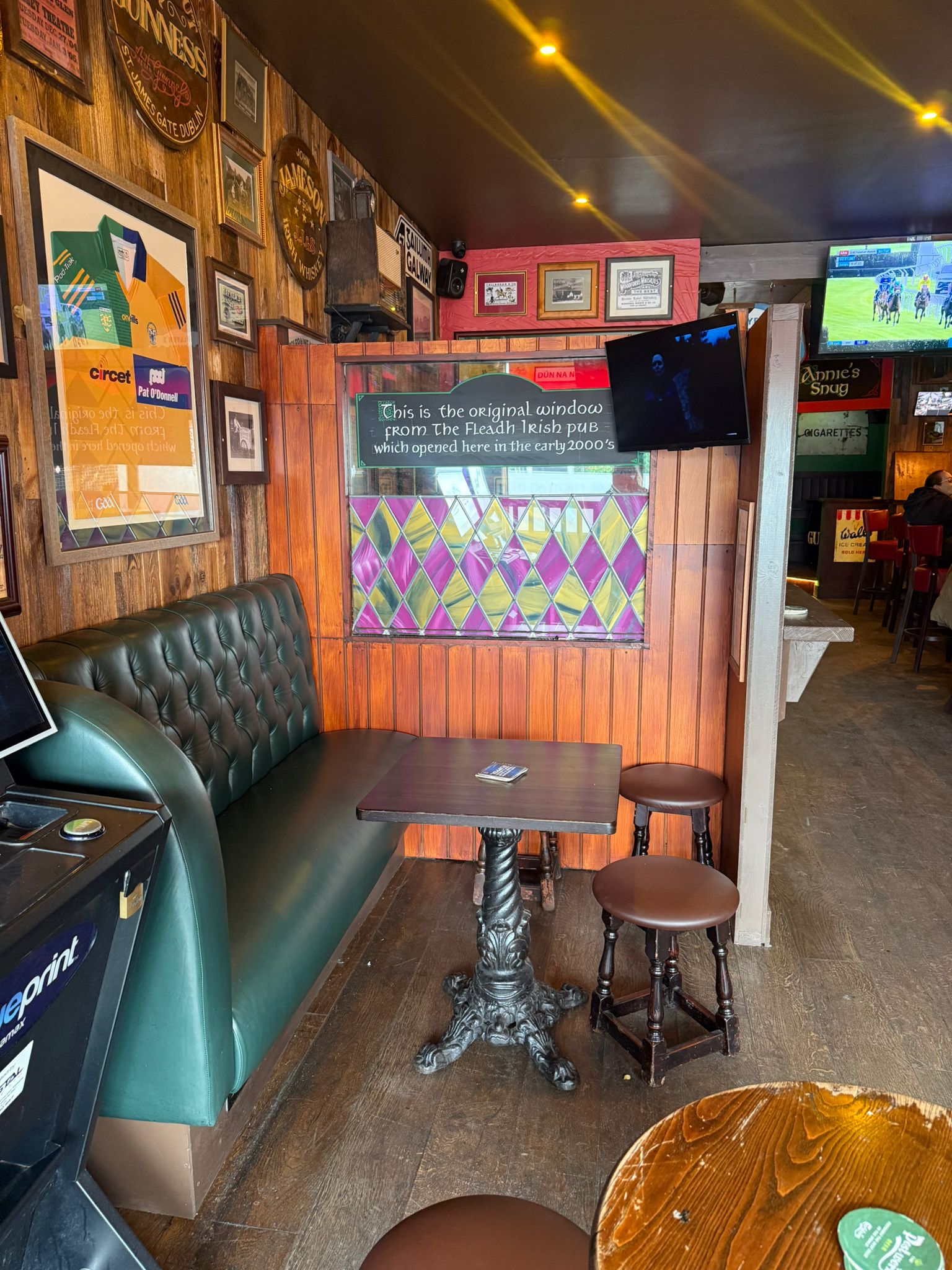 Original Florish Irish pub window with leather bench seating
